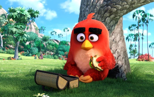 Red (Jason Sudeikis) enjoys lunch alone in the park in Columbia Pictures and Rovio Animation's ANGRY BIRDS.